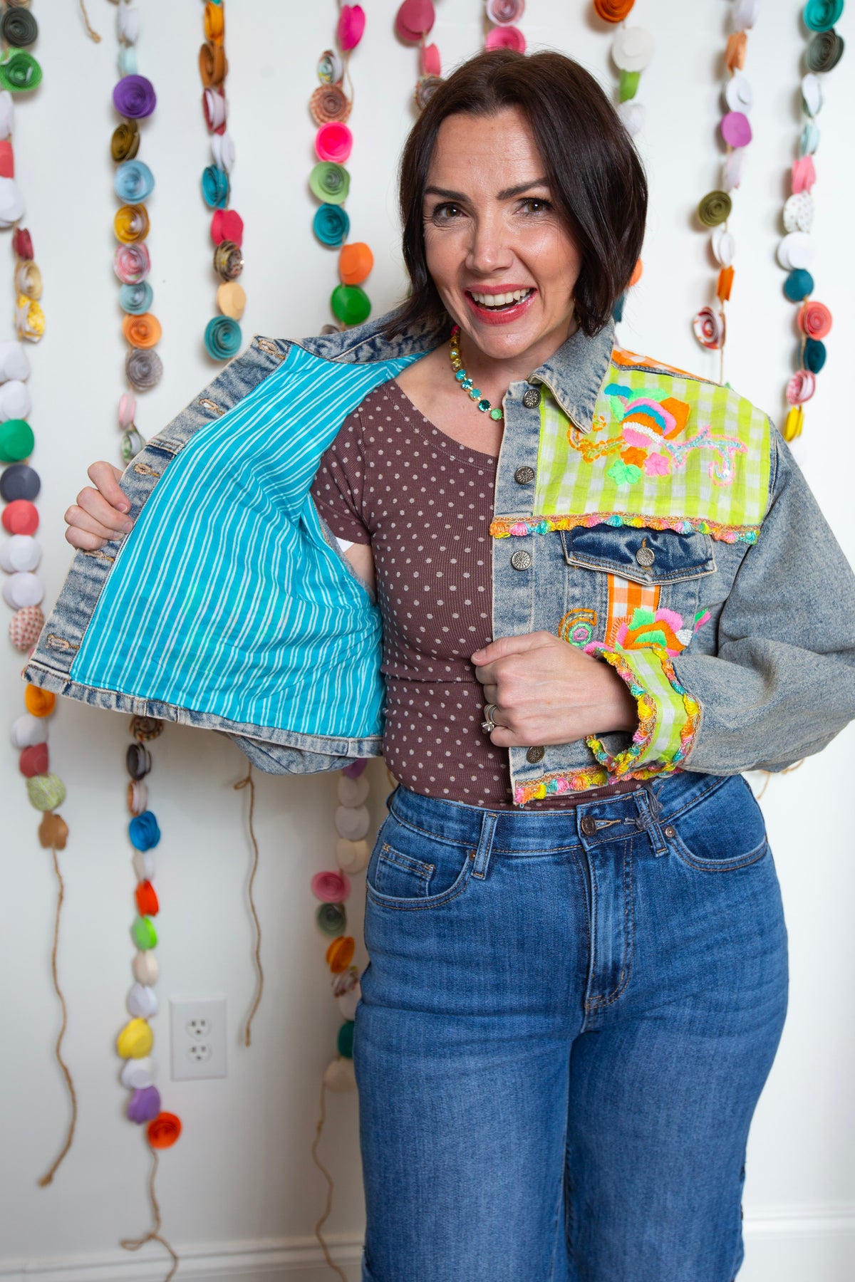 Emma Jean Jacket held open to reveal the turquoise striped lining