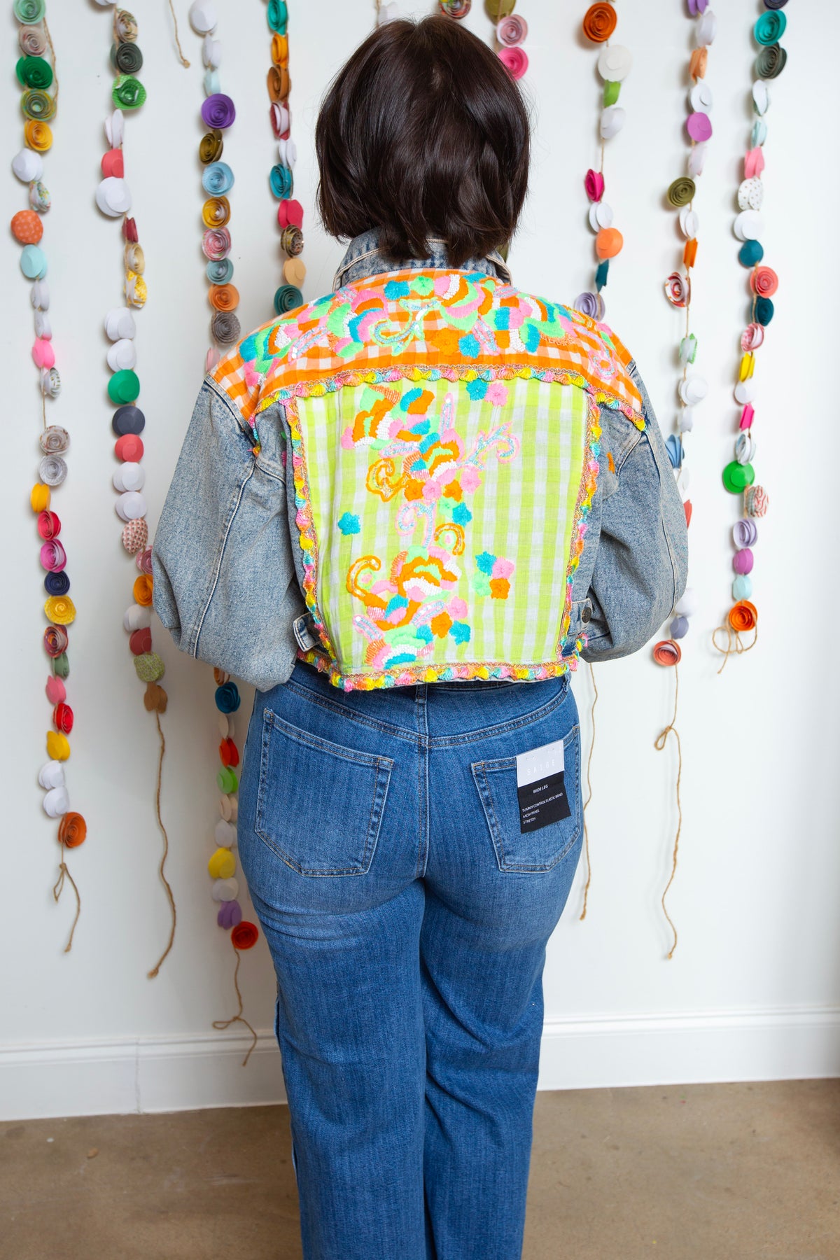 Back view of the Neon Embroidered Emma Jean Jacket with a lime gingham yoke and embroidery