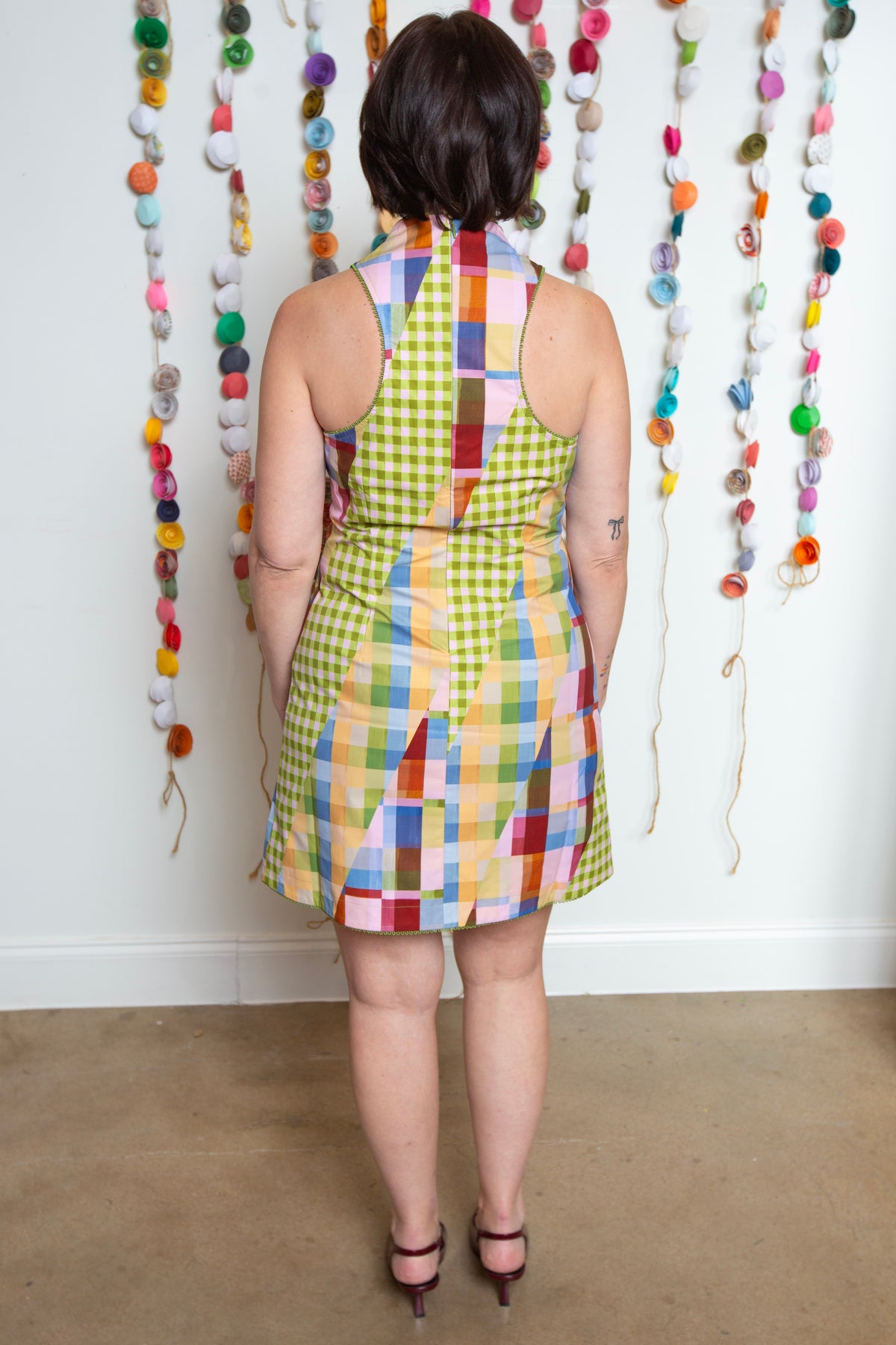 Back view of the Adeline Dress showing the racerback cut and colorful check print