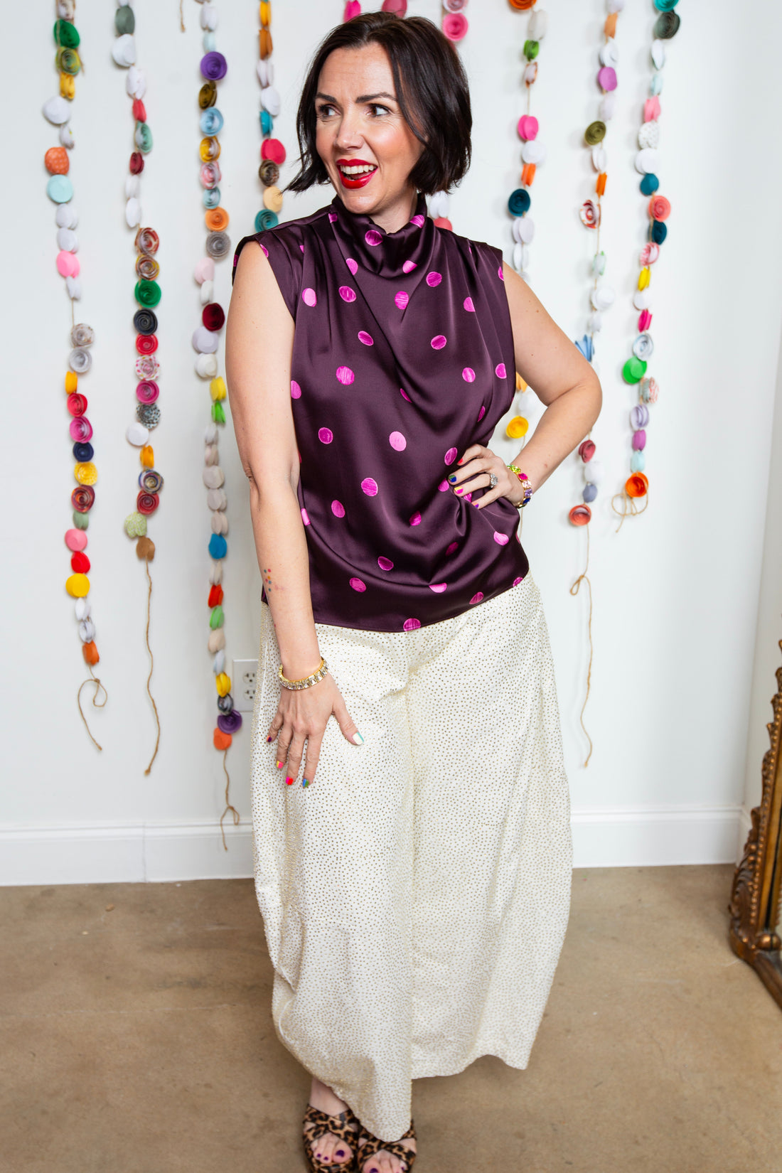 Katie wearing the Plum Dot Blouse with ivory rhinestone barrel pants and jewelry