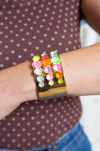 Side view of the gold Multi Color Stone Cuff showing the rainbow crystal rows