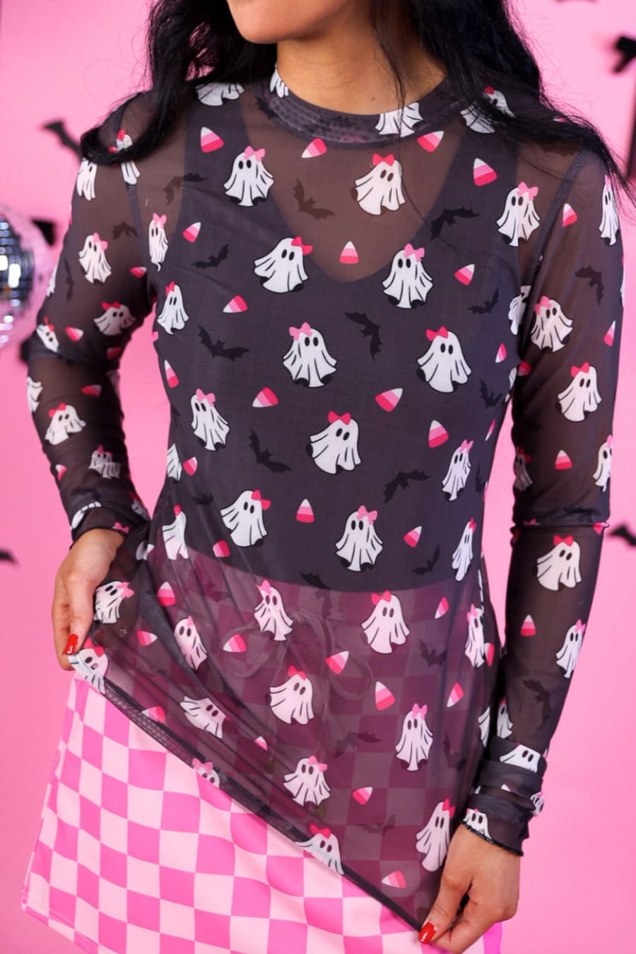 Close-up of the black mesh top showing the ghost, bow and candy corn print